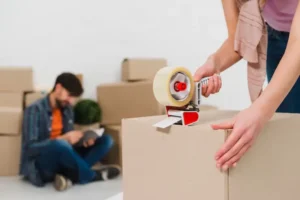 packing-boxes-with-building-tape-order-move-new-housing_23-2148095501