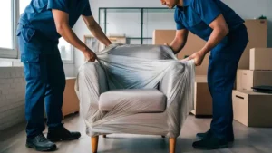 two-men-are-wrapping-piece-plastic-from-couch_1040470-15908